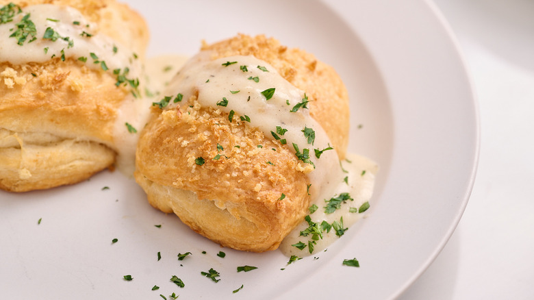 Chicken croissant pillow with cream sauce on a plate