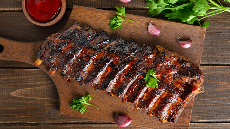 overhead view of barbecue pork ribs on cutting board