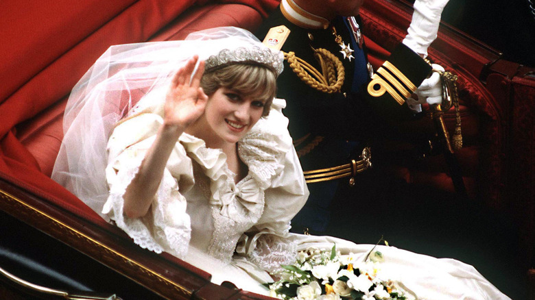 Princess Diana waving from car on her wedding day