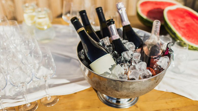 Bottles of wine on ice at party