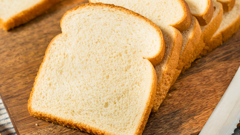 Slices of white bread on a kitchen countertop