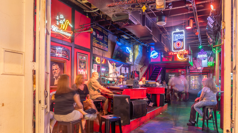 inside view of patrons at a dive bar