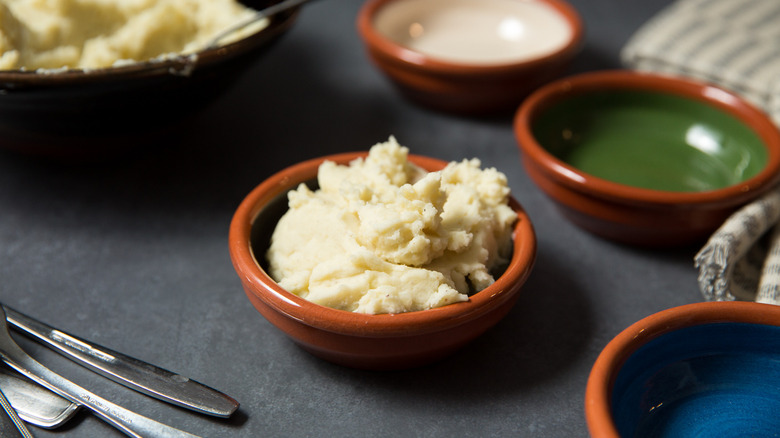 mashed potato in terracotta bowl