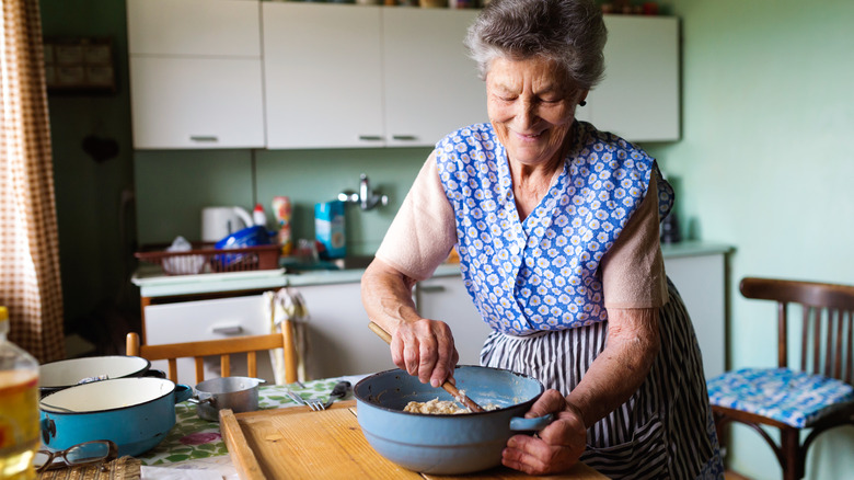 Senior woman baking in her home kitchen