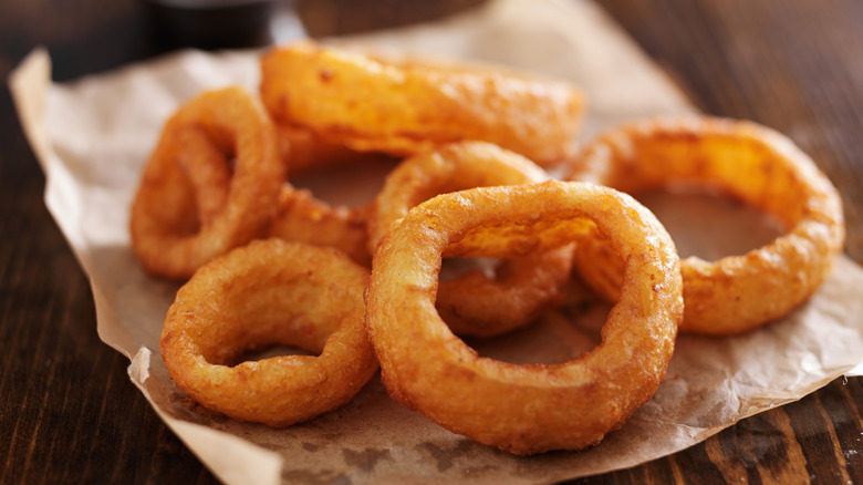fried onion rings on paper
