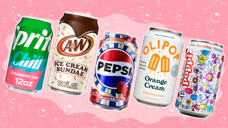 Assorted soda cans with pink background