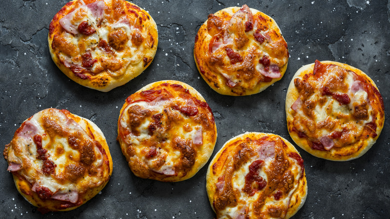Mini biscuit pizzas on a table