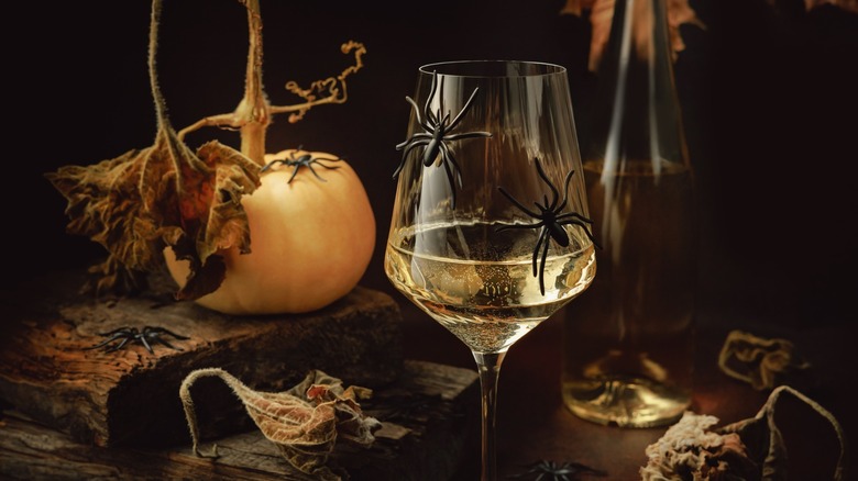 wine glass with spiders and pumpkins for Halloween party