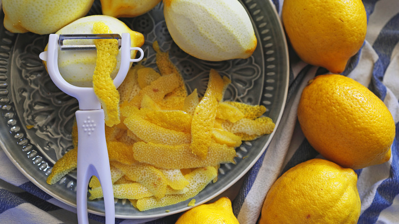 Peeled lemons on patterned plate