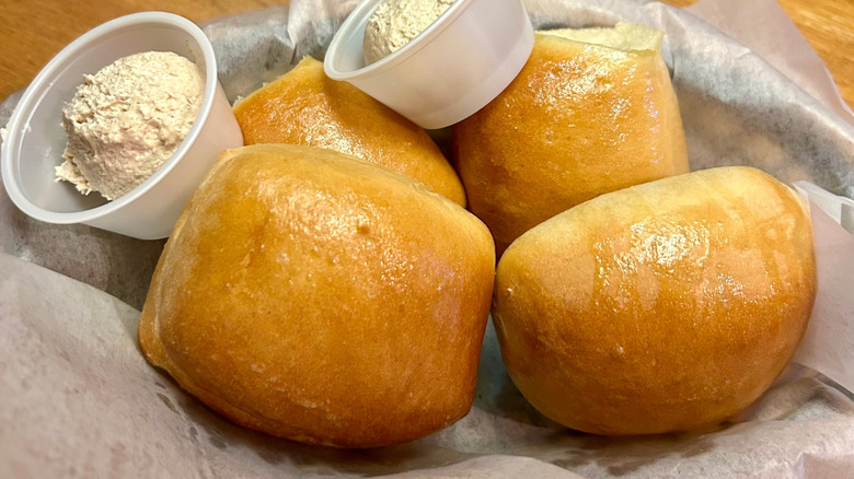 Close up of Texas Roadhouse rolls with cinnamon butter.
