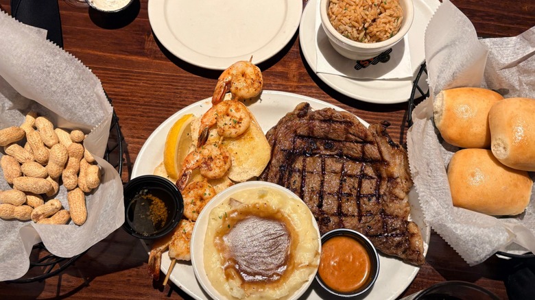 Plates of steak, shrimp, and sides at Texas Roadhouse