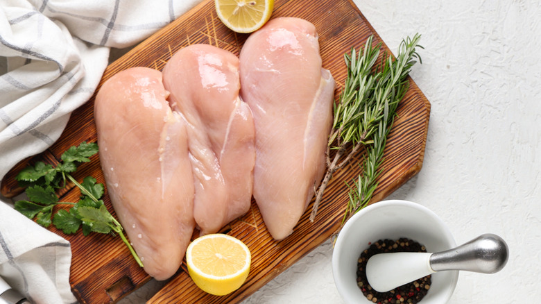 Raw chicken on a chopping board