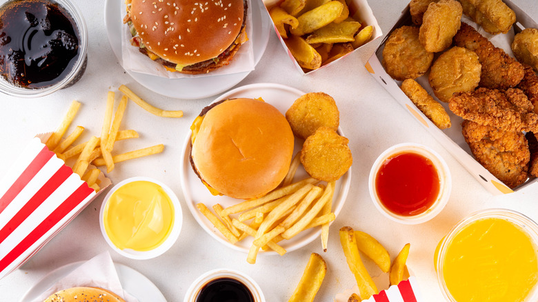 Assortment of generic fast food items on white background