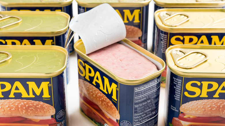 Open Can of SPAM and seven unopened cans of SPAM