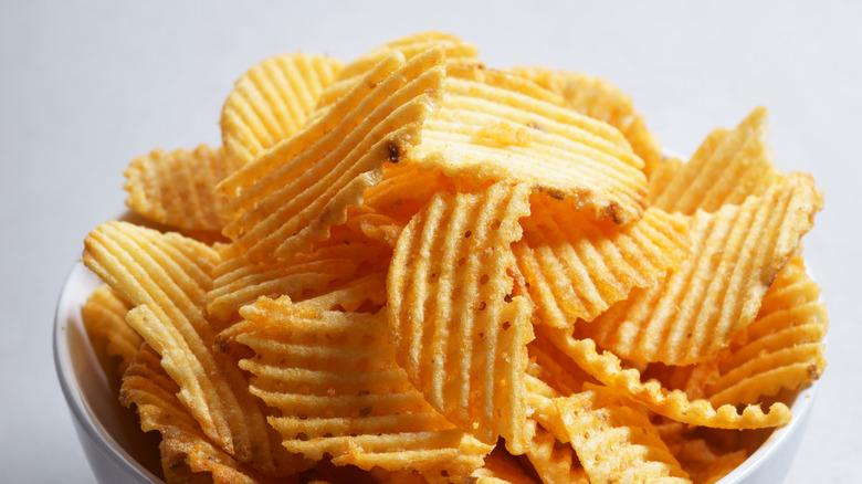 Bowl of wavy potato chips