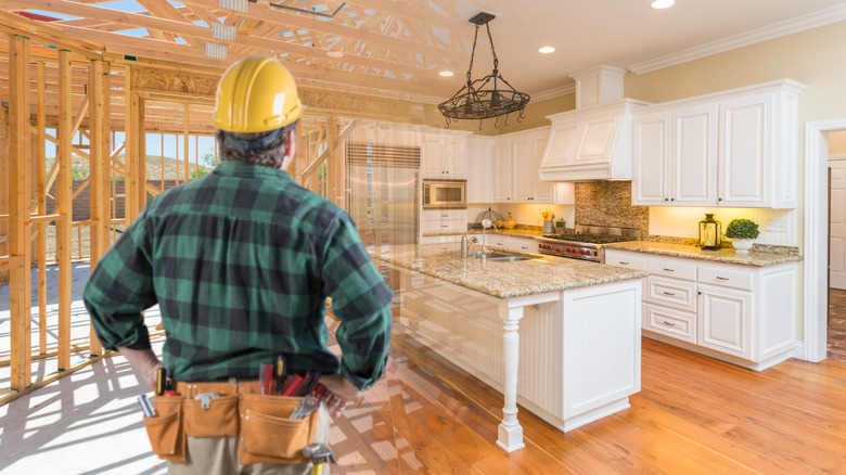 contractor standing in front of kitchen remodel