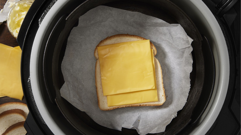 Grilled cheese sandwich being made in air fryer