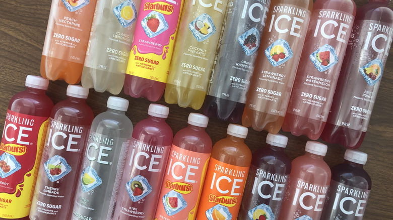 17 different Sparkling Ice bottles laid out next to another.