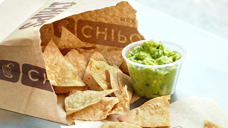 Chipotle's guacamole with one taco on paper