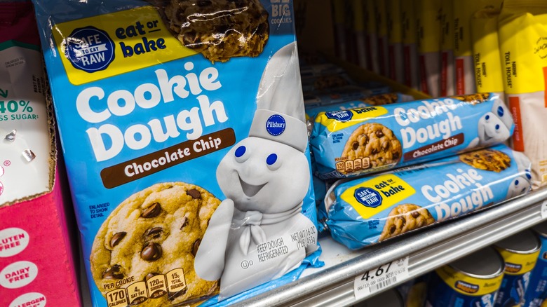 Packages of Pillsbury cookie dough on grocery store shelf