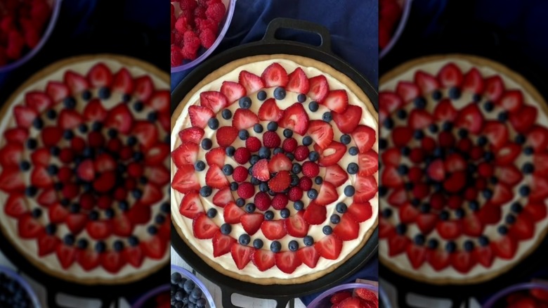 Cookie dough pizza topped with strawberries, blueberries, and raspberries
