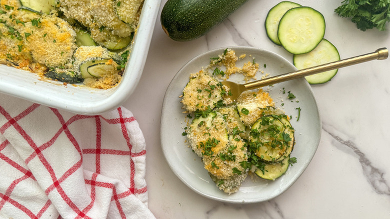 Zucchini gratin served from baking dish onto plate