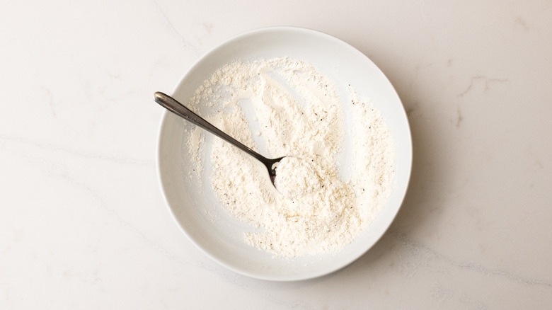 bowl containing flour and seasonings