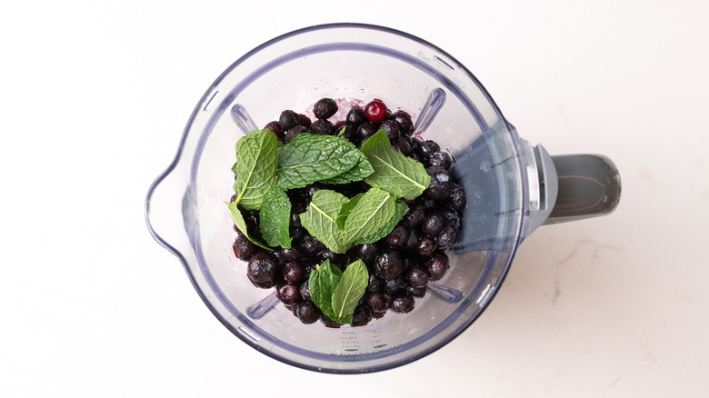 aerial view of frozen mojito ingredients in a blender