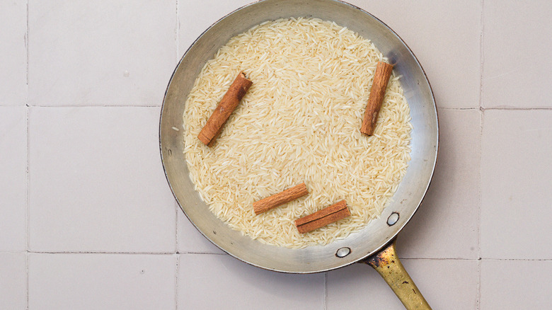 rice and cinnamon in pan