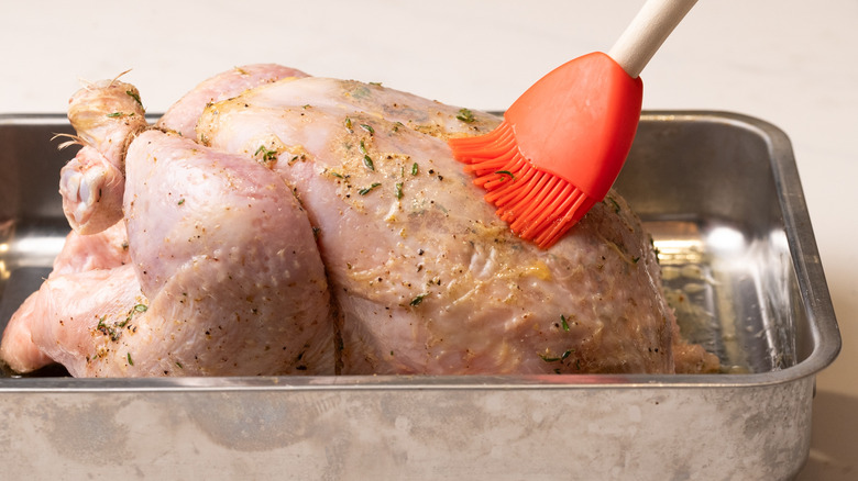 basting a roast chicken