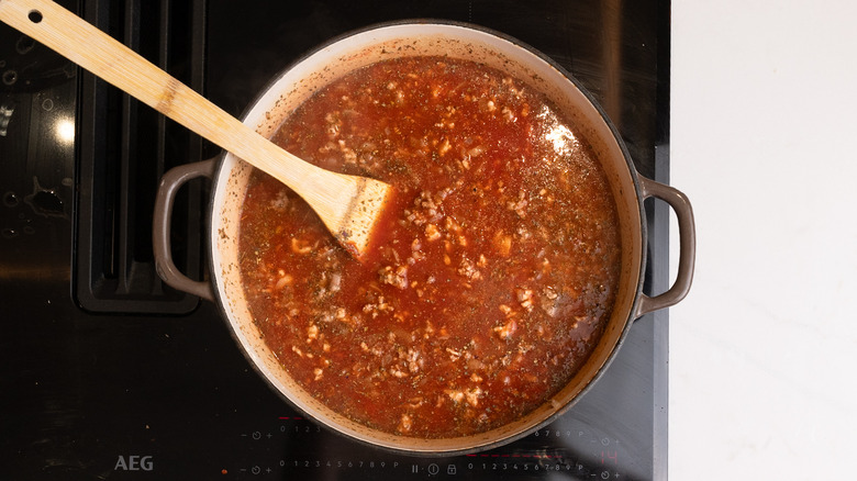 meat sauce simmering in pan