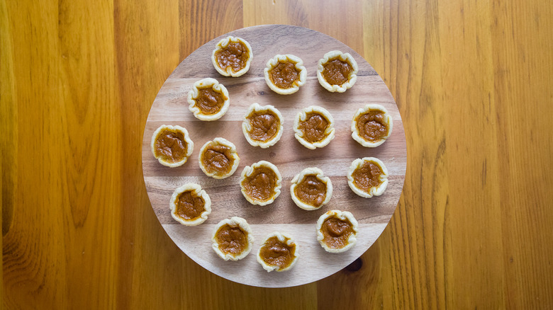 mini pumpkin pies on board