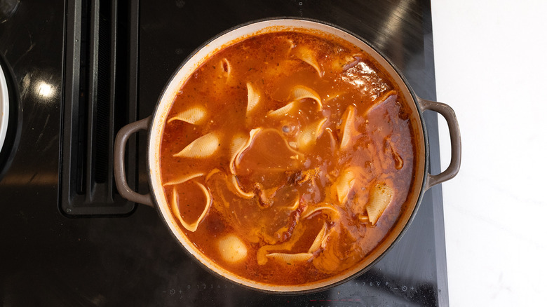 cooked pasta in chicken broth