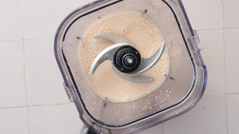 blended rice and cinnamon with water in blender