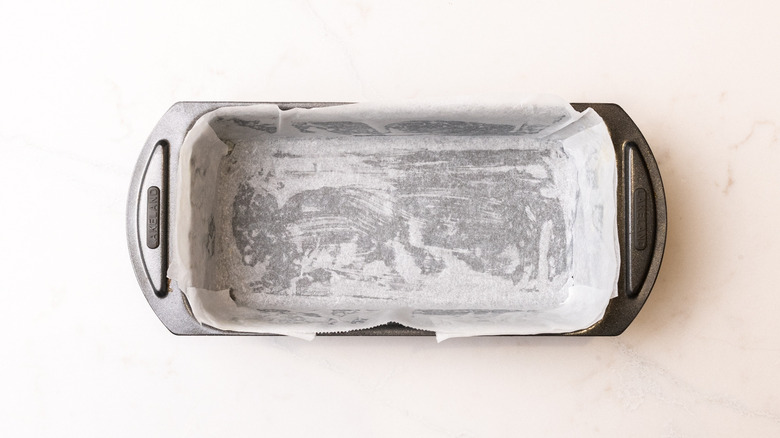 Loaf pan lined with parchment paper