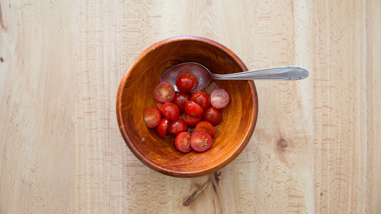 tomato salad in wooden bowl