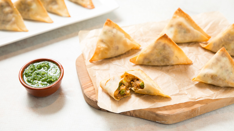 baked samosas served on table