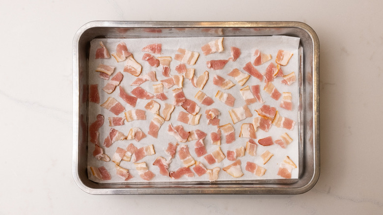 bacon pieces on baking sheet