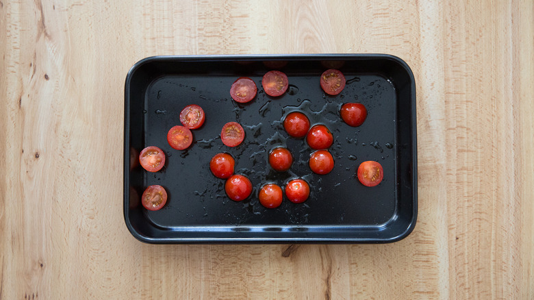 tomatoes in black roasting pan