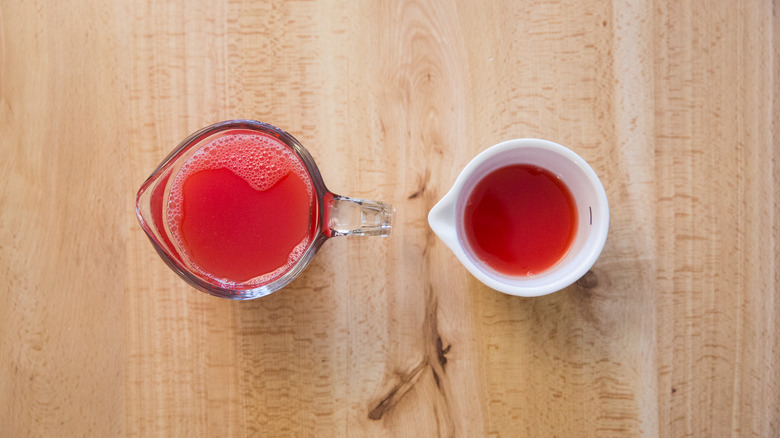 watermelon juice in measuring cups