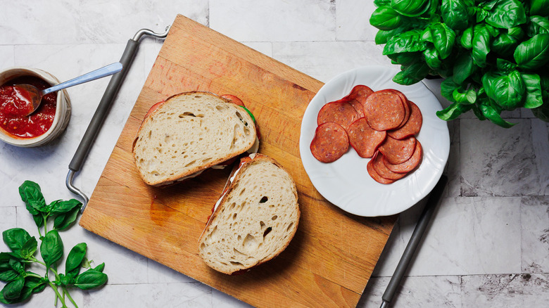 Two grilled cheese sandwiches on cutting board
