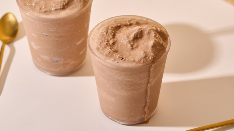 chocolate frosty in a cup on table