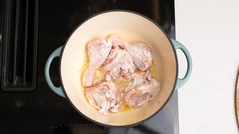 chicken cooking in a pan