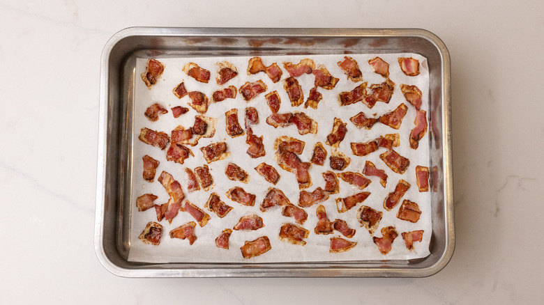cooked bacon on baking sheet