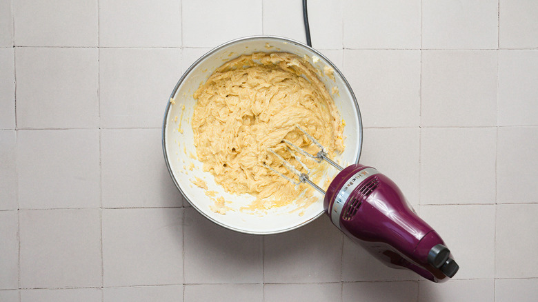 Wet ingredients in bowl with mixer