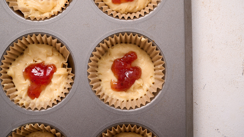 strawberry jam added to muffin batter