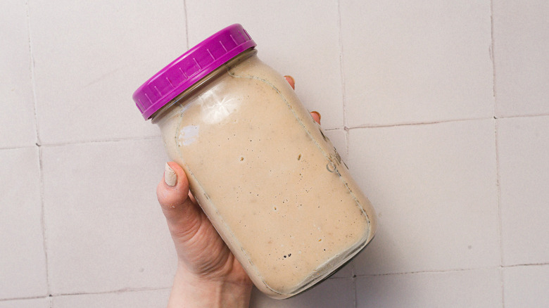 Hand holding jar with horchata