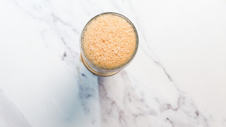 Glass with frothy egg cream