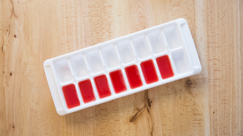 watermelon ice cubes in tray