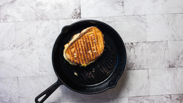 A grilled cheese in a cast iron grill pan